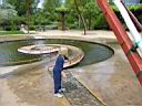 IMG_0597.JPG: Hopland: Solar Center Monica washing hands at fountain - Sol center Monica vasker haender i springvand